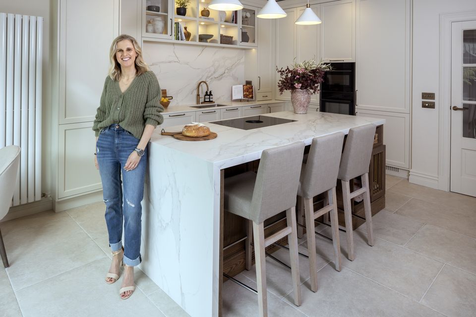 Paula McCarthy in the newly renovated kitchen of her home in south county Dublin. The oak and painted units are by Daniel Martin Kitchens. Photo: Tony Gavin